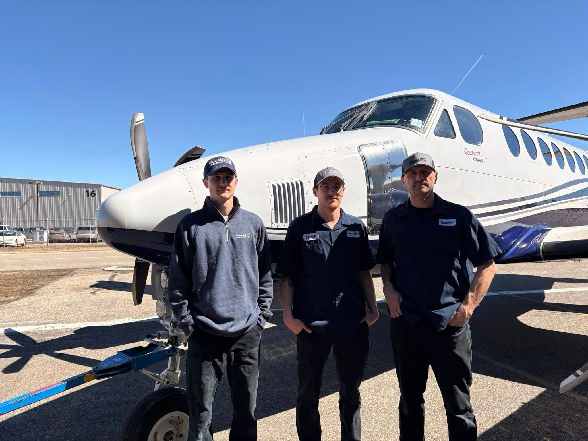 Good Spirit Air Service team members in front of a King Air aircraft
